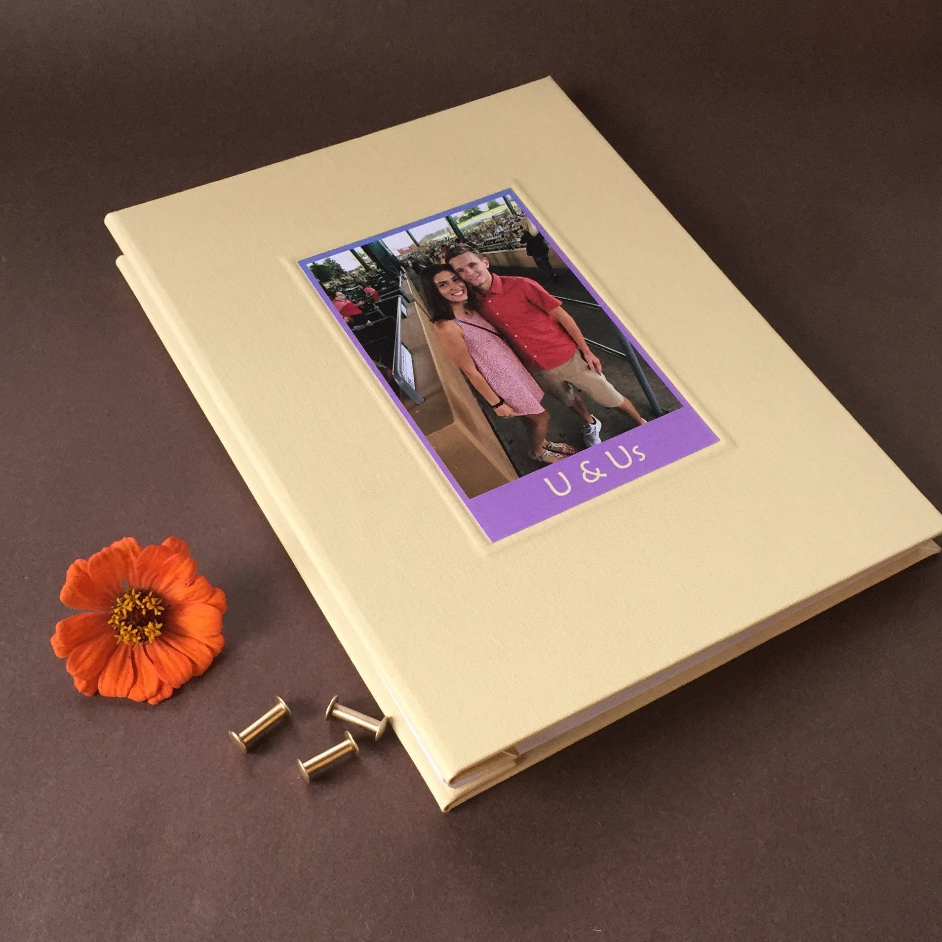 Custom made anniversary scrapbook album with removable pages. Custom engagement photo inlaid on the cover. Heirloom quality. Brass screw posts closure.