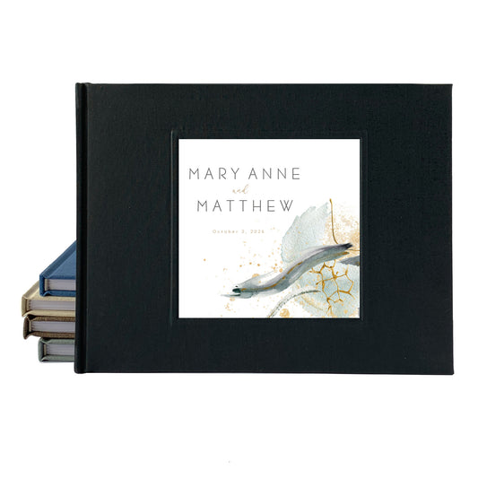 Black wedding guest book with modern minimalist design. Personalized names and date on cover.