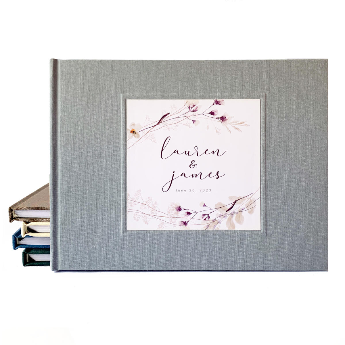 Gray bridal guest book with personalized plum floral design on the cover.