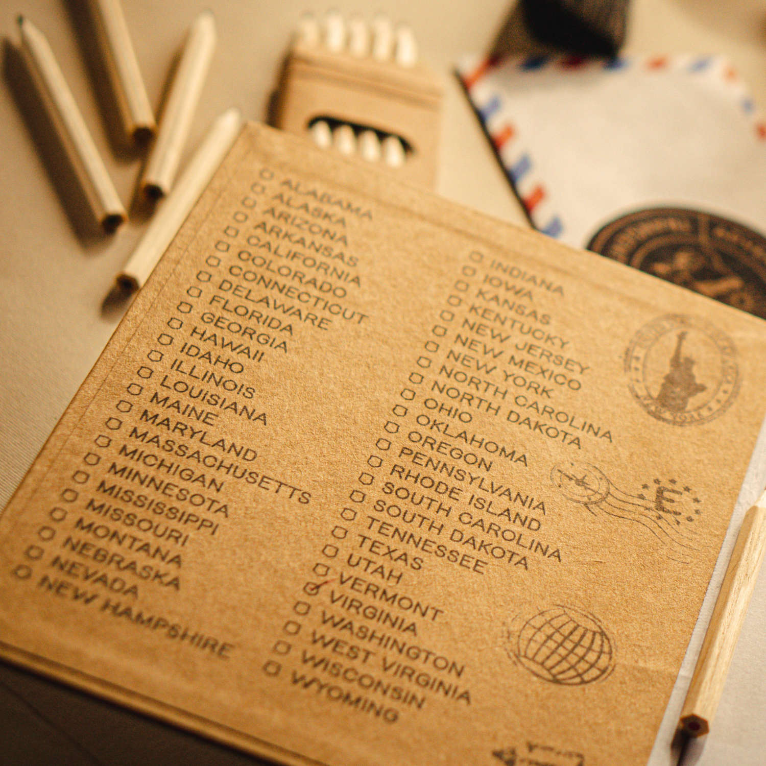 checklist of usa states on the inside front cover of a personalized travel journal