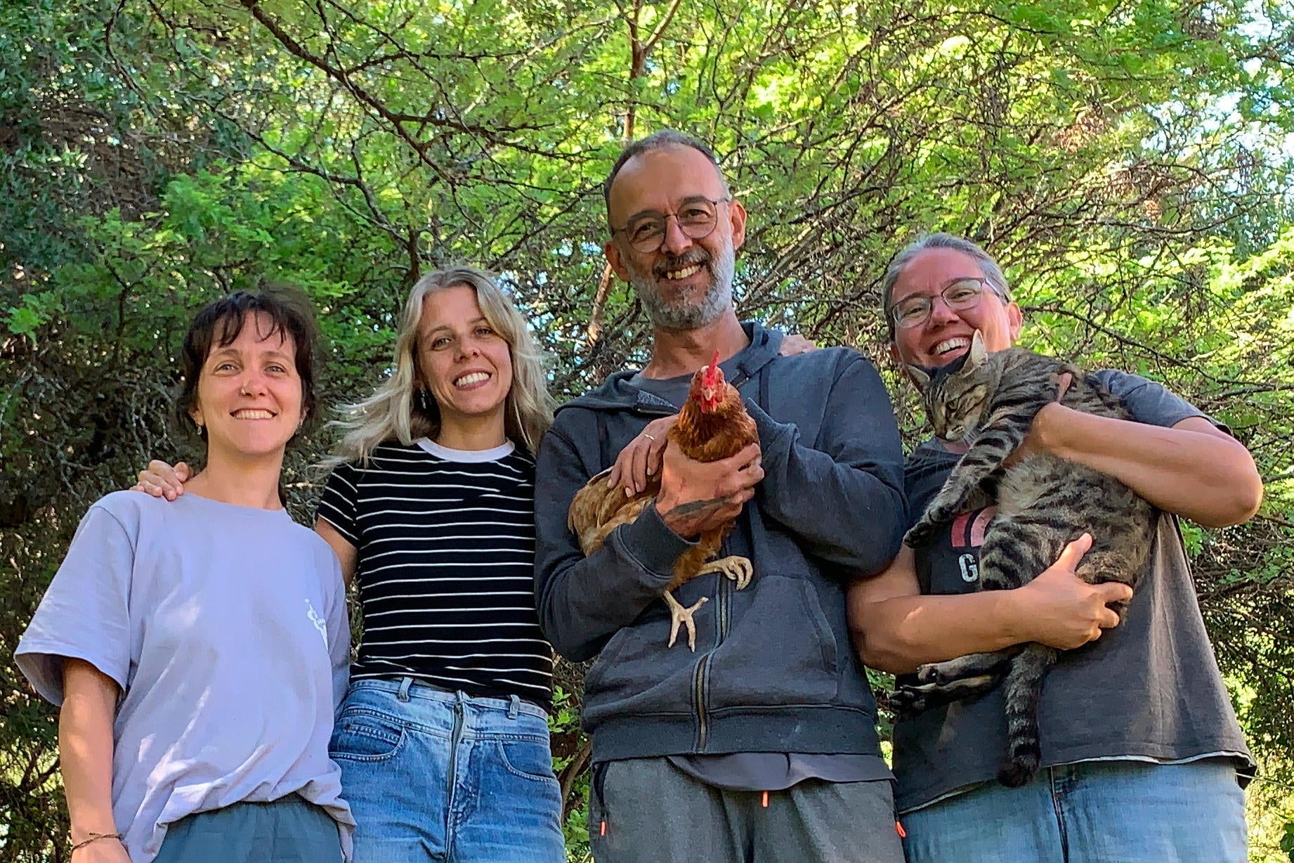 Transient Books team in the binding studio, crafting custom hand-bound books with care, quality, and traditional bookbinding techniques.
