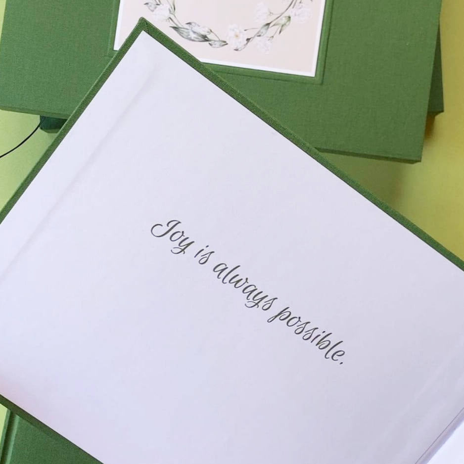 A joyful dedication printed on the inside front cover of a custom hand bound book.