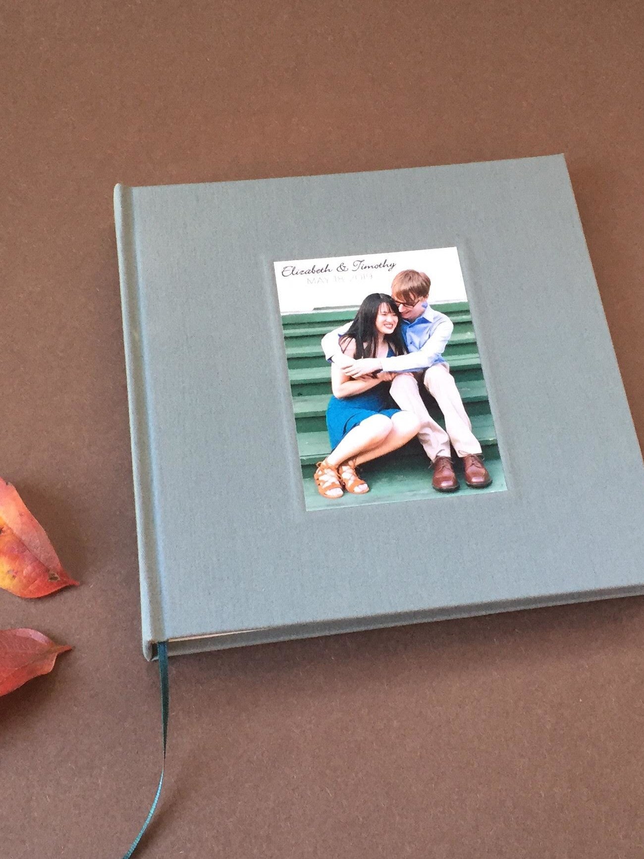 Romantic wedding guest book – with  your photo on cover. Made to reflect your love story and preserve messages from family and friends.