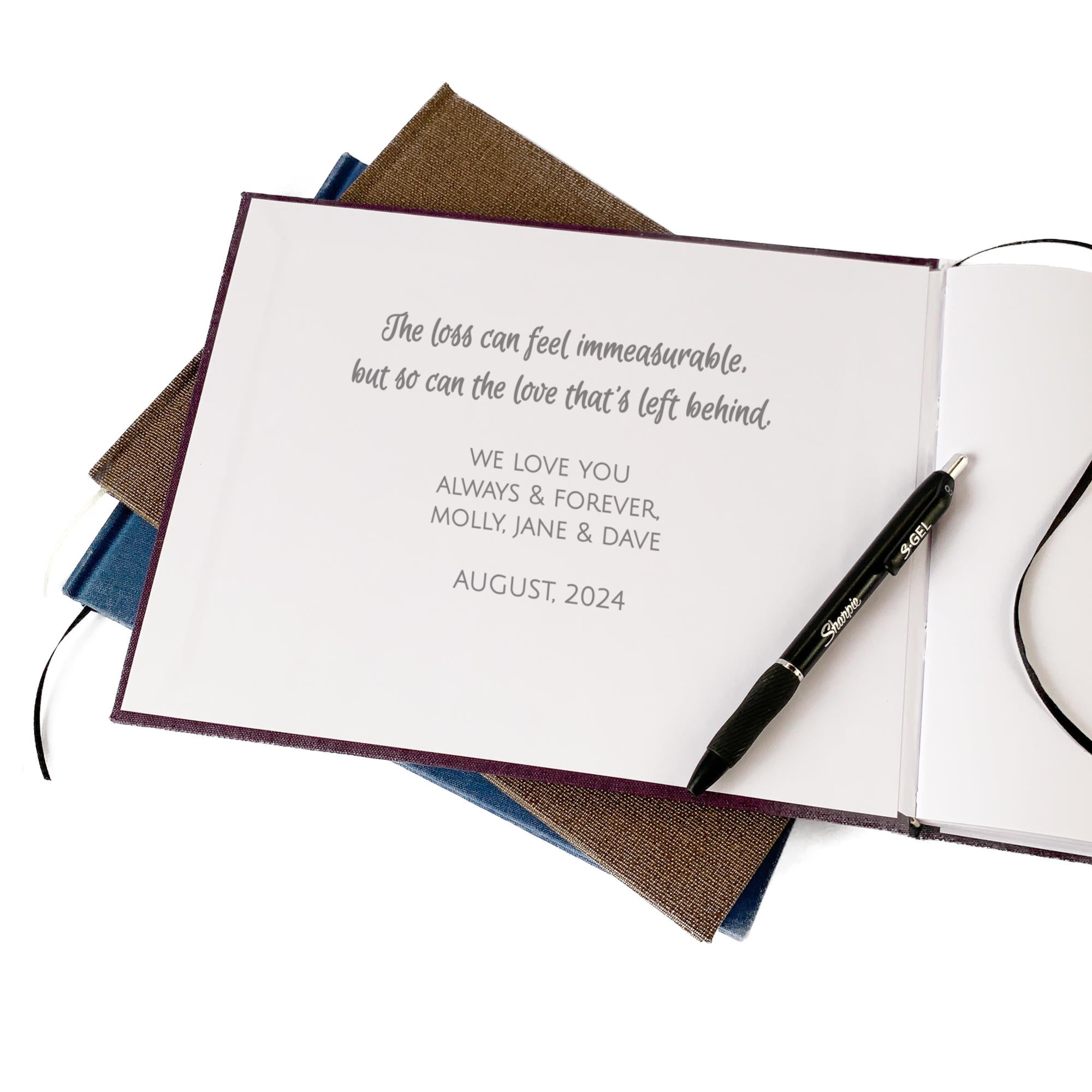 Personalized funeral guest book with a heartfelt dedication message printed on the inside cover, offering a meaningful tribute.