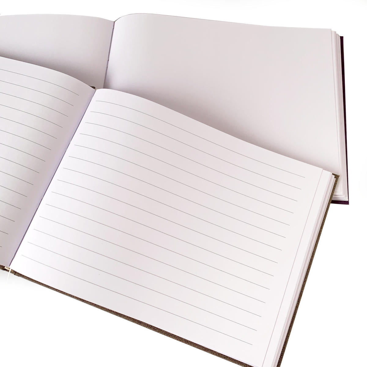 Open guest books showing lined and blank page options for personalized guest books.