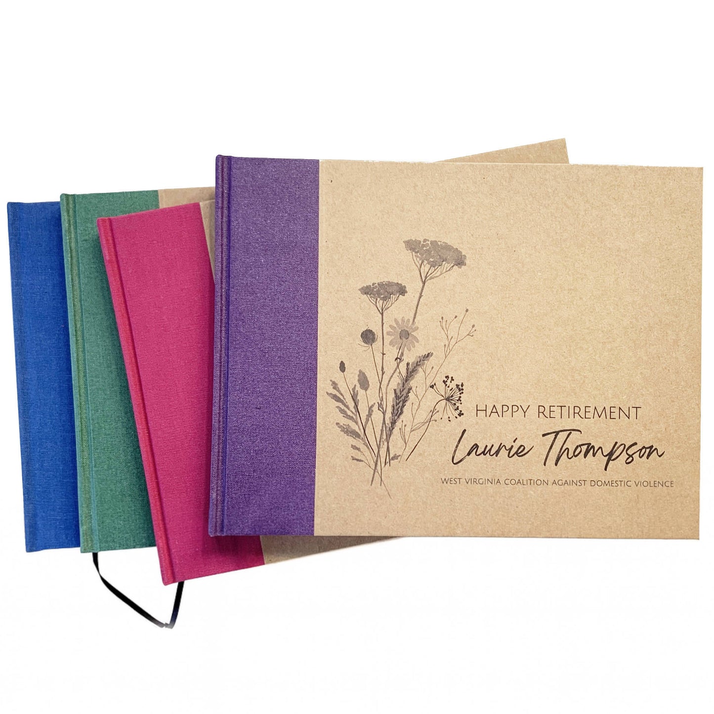 Set of personalized retirement guest books with a variety spine canvas colors. Hardback with personalized wildflower artwork cover design with custom names and text.