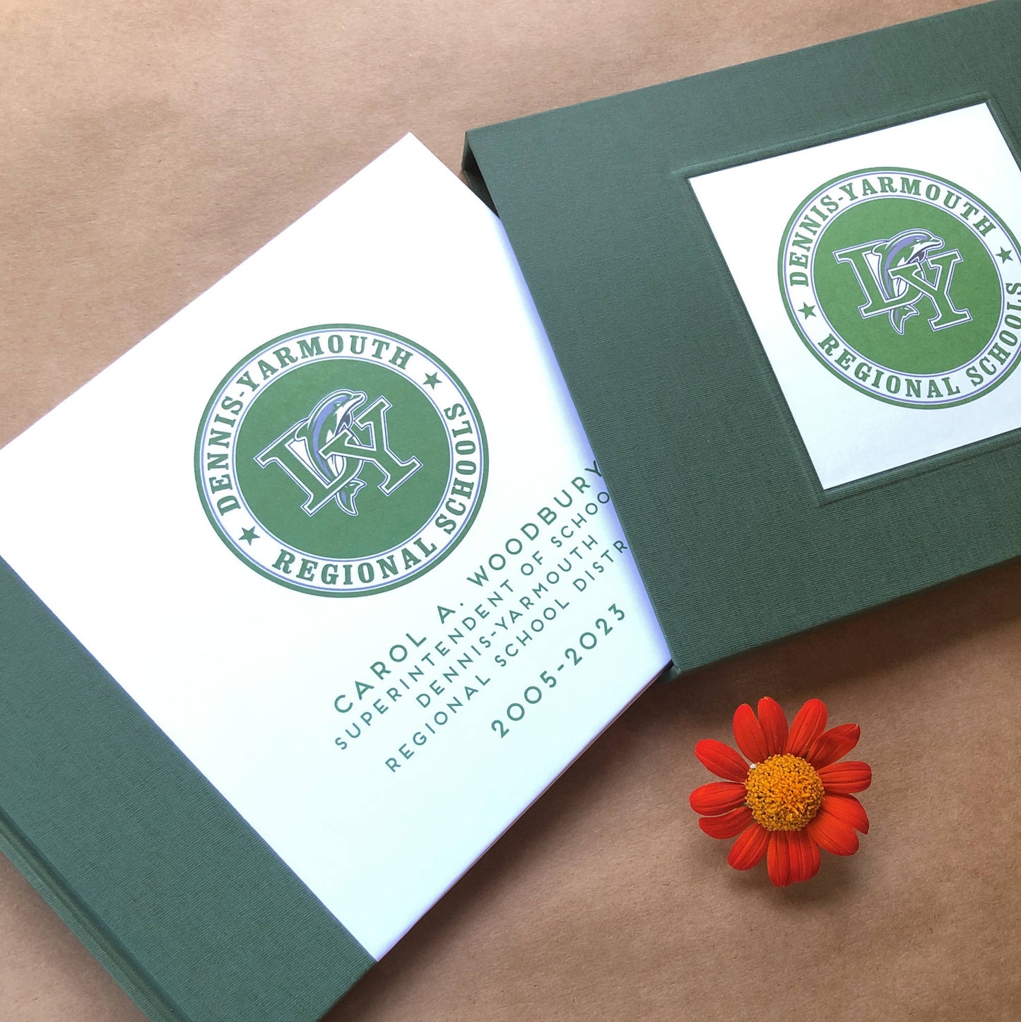 Personalized retirement guest book with green linen spine canvas with matching book slipcase. Hardback with personalized logo artwork cover design with custom names and date.