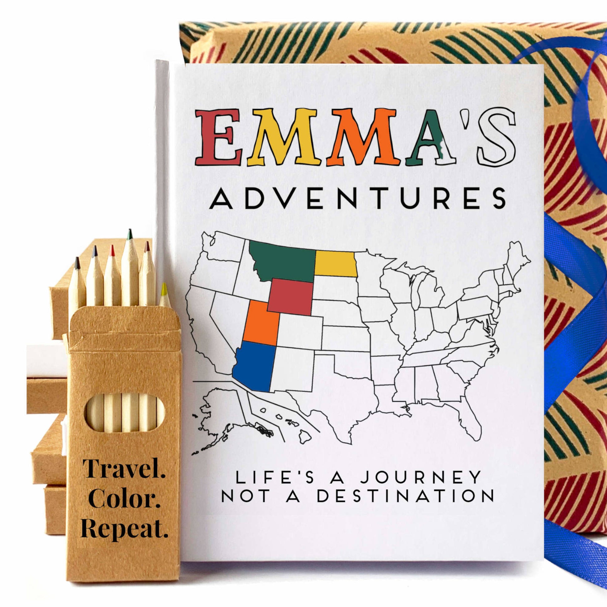 Custom travel journal for USA road trips with a map for coloring in. Personalized text on cover, hardback, handbound. White book with colored pencils.