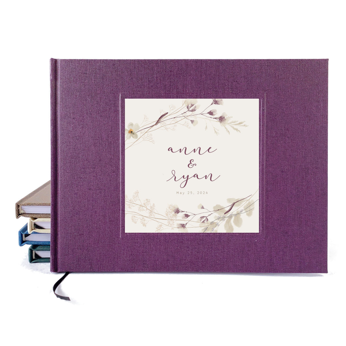 Wedding guest book with dark purple cover and personalized plum floral design.