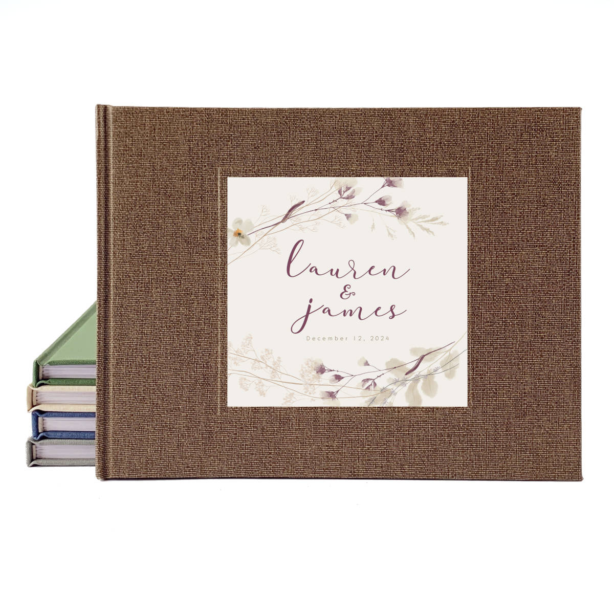 Personalized wedding guest book with brown hard cover and rustic floral design.