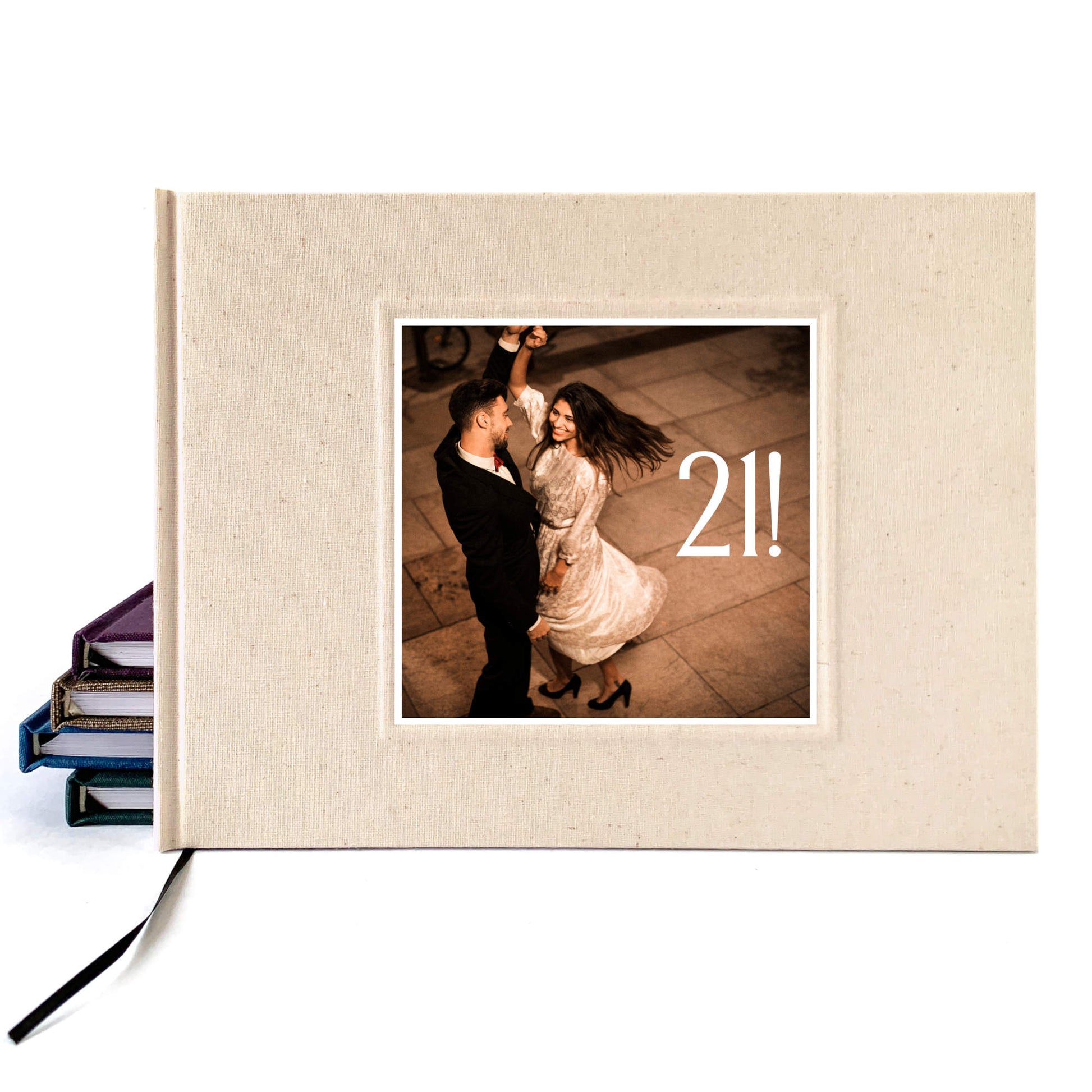 Birthday party guest book, cream linen hard back cover with photo on the cover of people celebrating. Custom text.