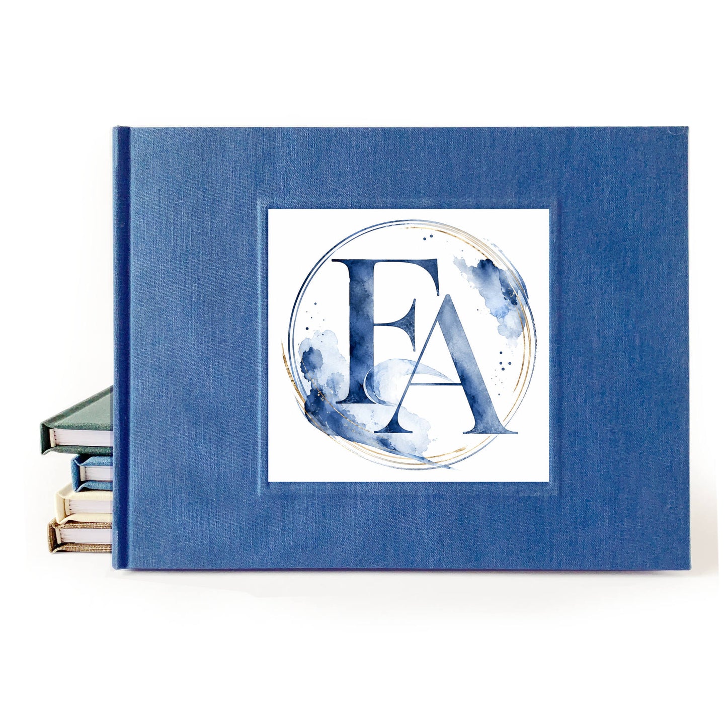 Blue linen wedding guest book with a watercolor wedding crest on the front.