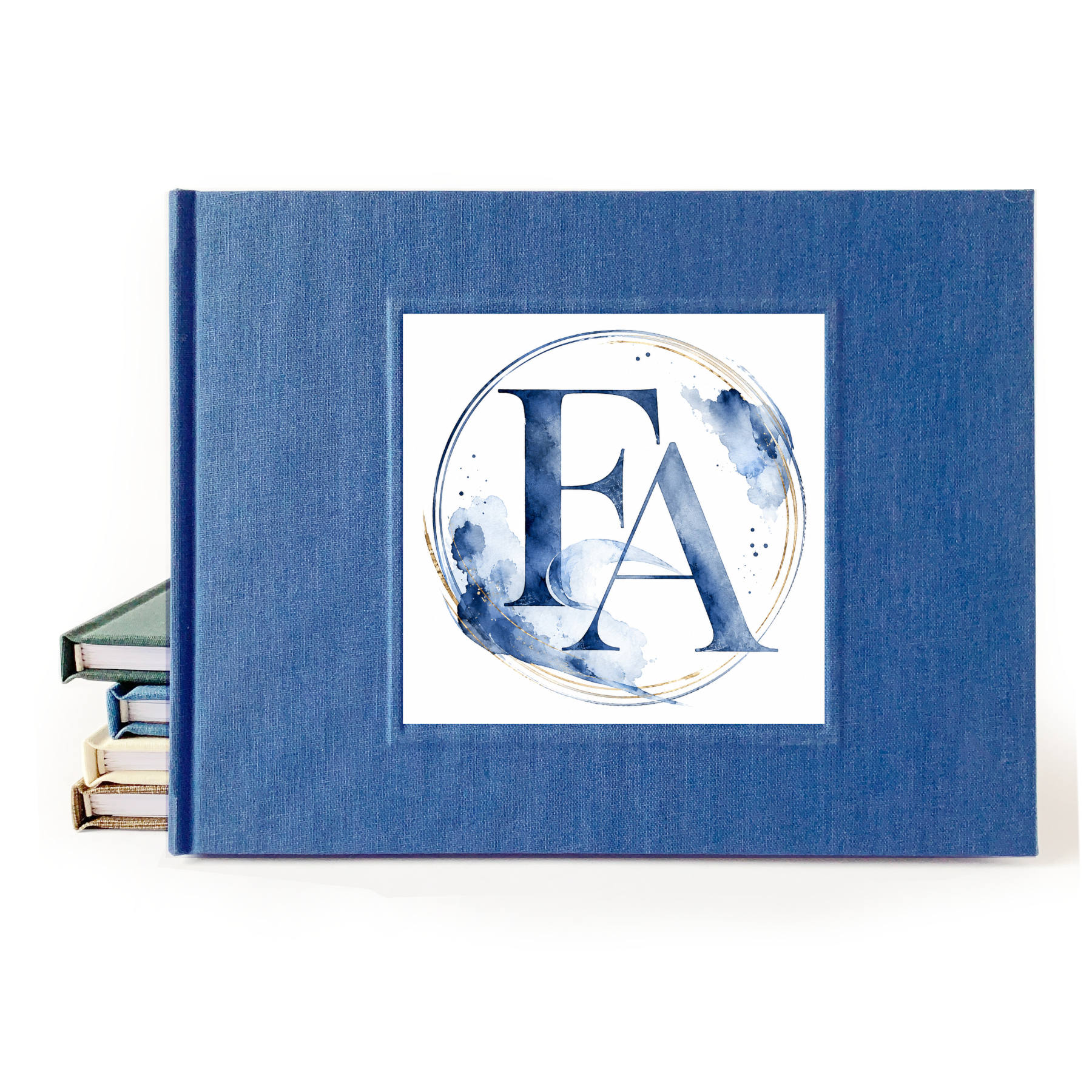 Blue linen wedding guest book with a watercolor wedding crest on the front.