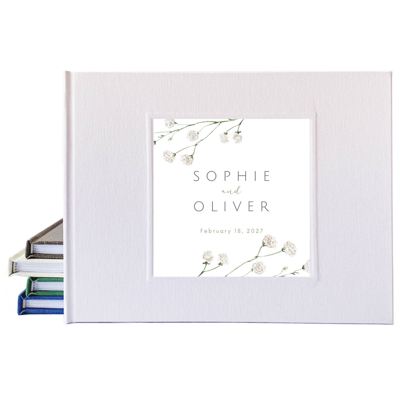 White linen wedding guest book with botanical cover art, personalized with bride and groom's names and their wedding date.
