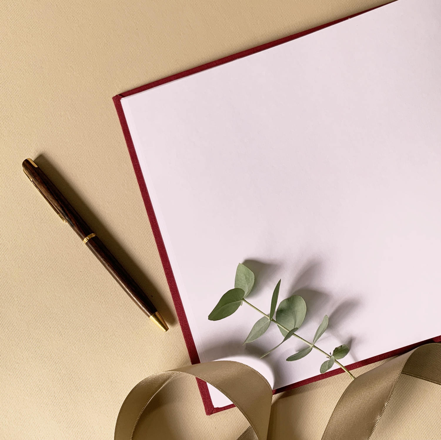 Hand bound bridal guest book with layflat pages open on a wedding guest book table ready to be used.