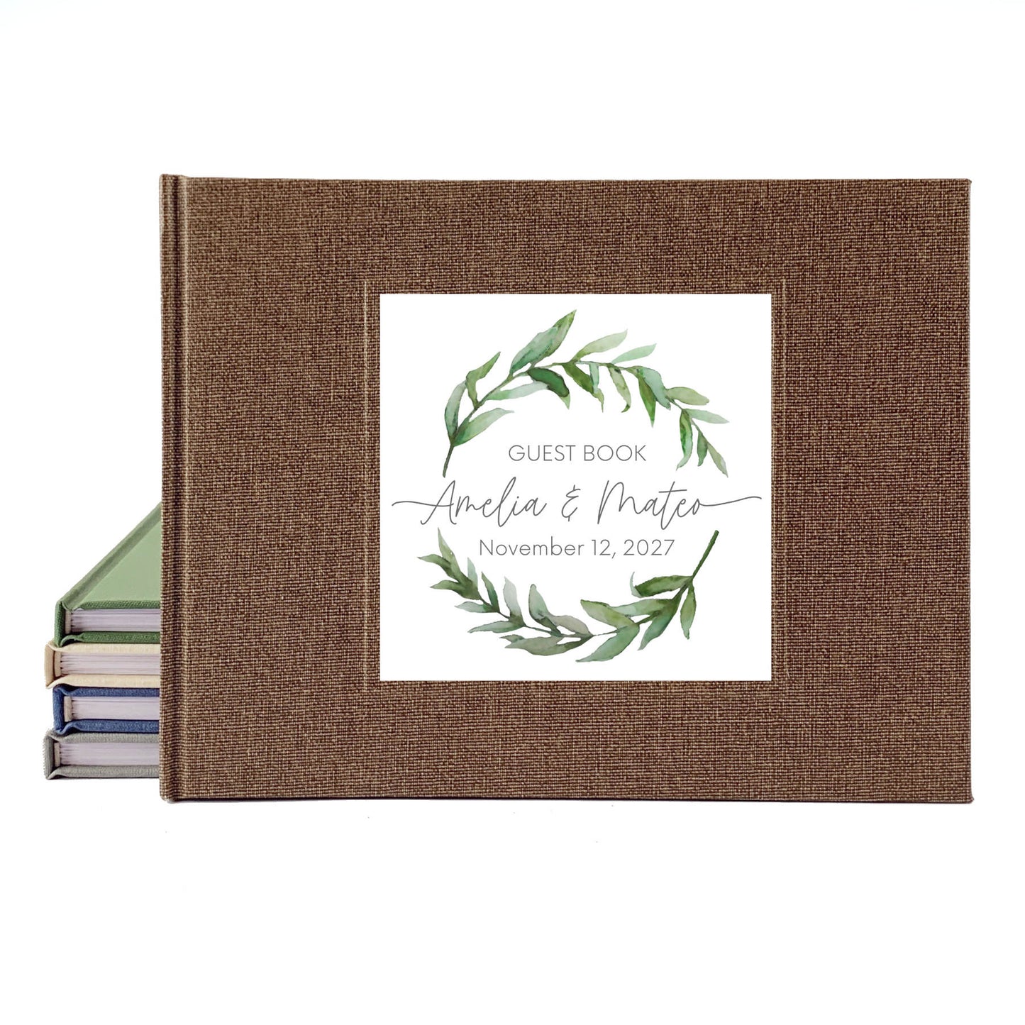 Brown linen wedding guest book with a watercolor wreath design, personalized on the front with the bride and groom's names.