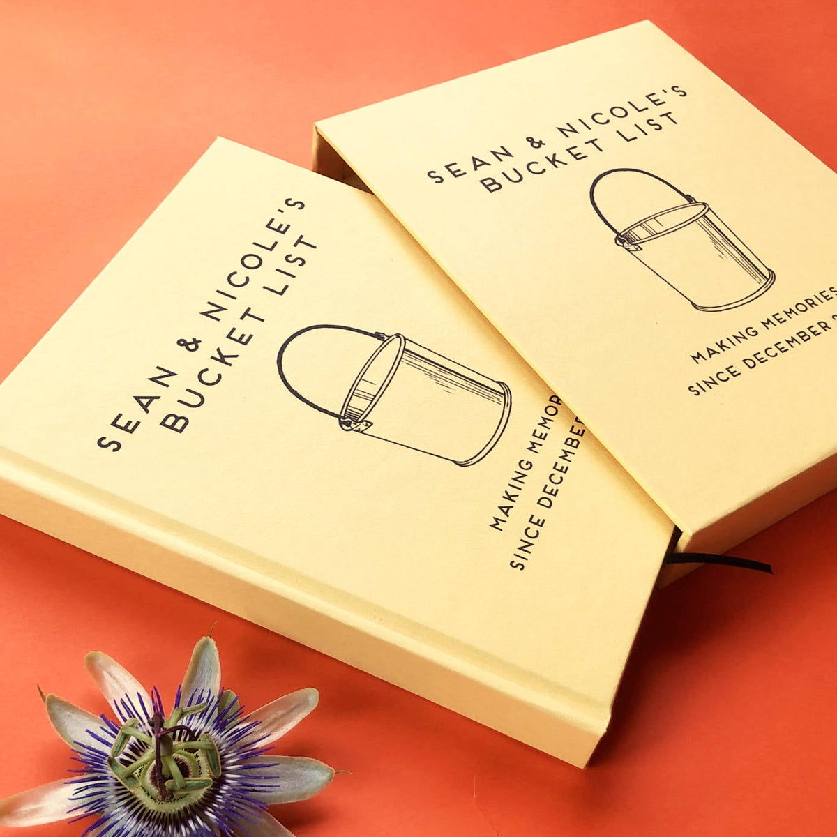 Personalized bucket list gift book for couples, hardback yellow cover. Custom text. Book is housed in a matching book slip case.