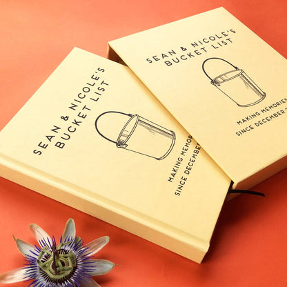Personalized bucket list gift book for couples, hardback yellow cover. Custom text. Book is housed in a matching book slip case.