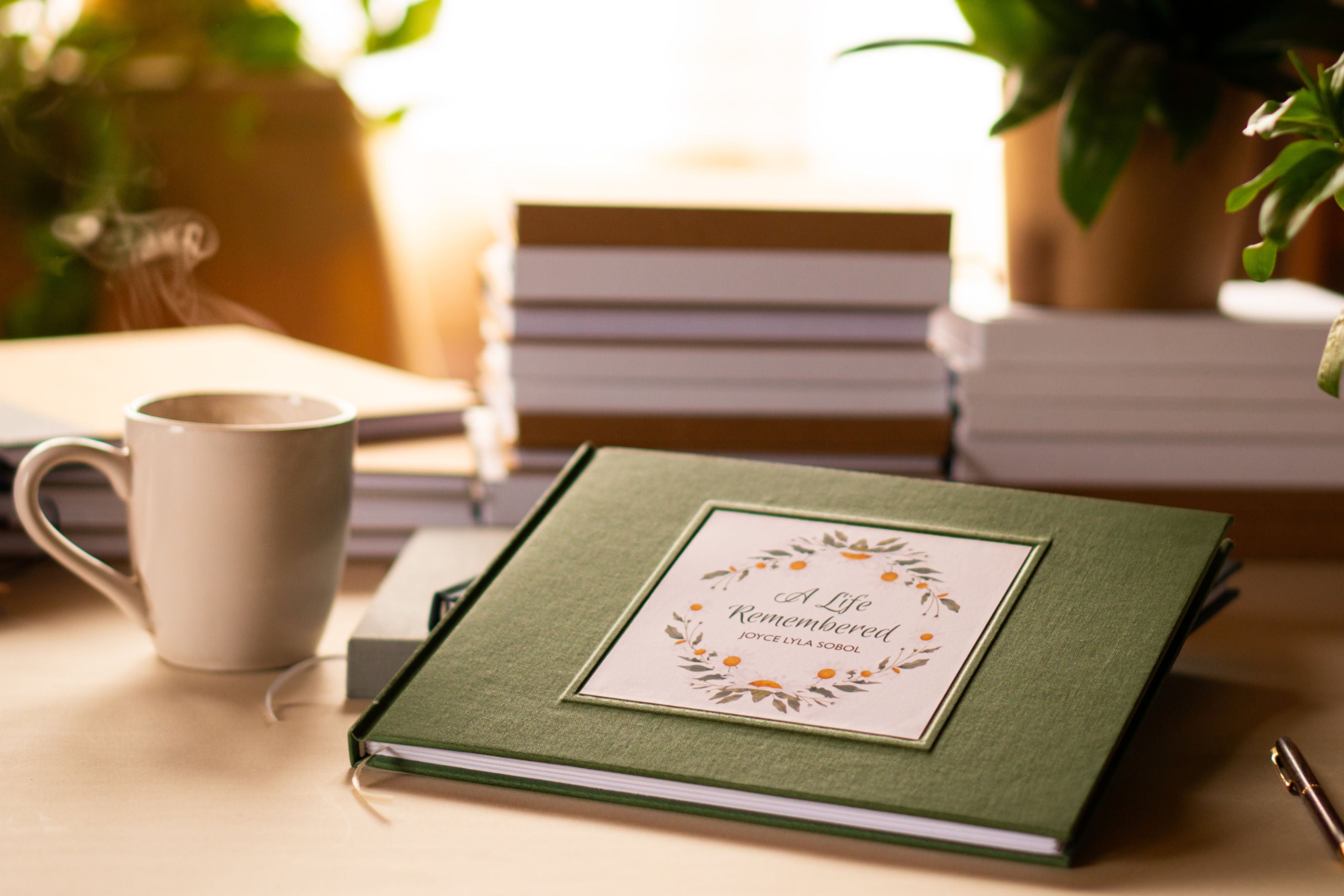 Green hand-bound personalized funeral guest book for a Celebration of Life memorial.