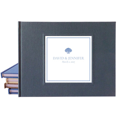 Dark gray linen wedding guest book for a coastal wedding with bride and groom's names and their wedding date on the cover.