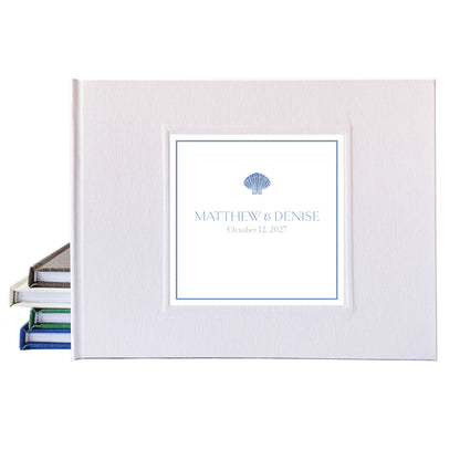 Dusty blue coastal design for a custom wedding guest book. White linen hardback cover, personalized name and date.