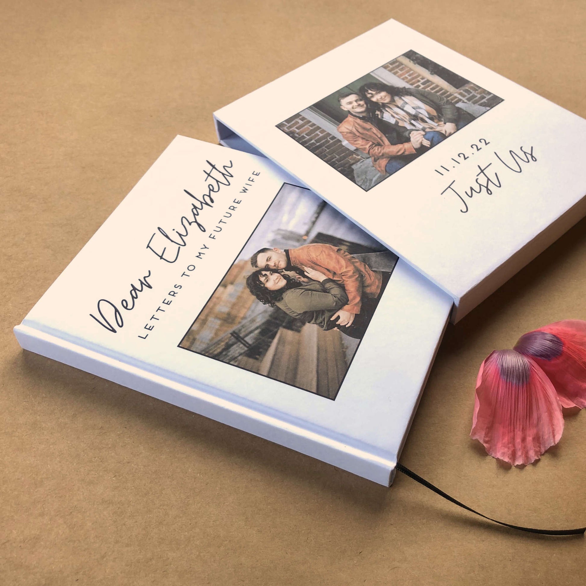 Personalized, hand bound couple's journal with a custom photo and text on the white, hardback cover. Book is housed in a matching book slipcase.