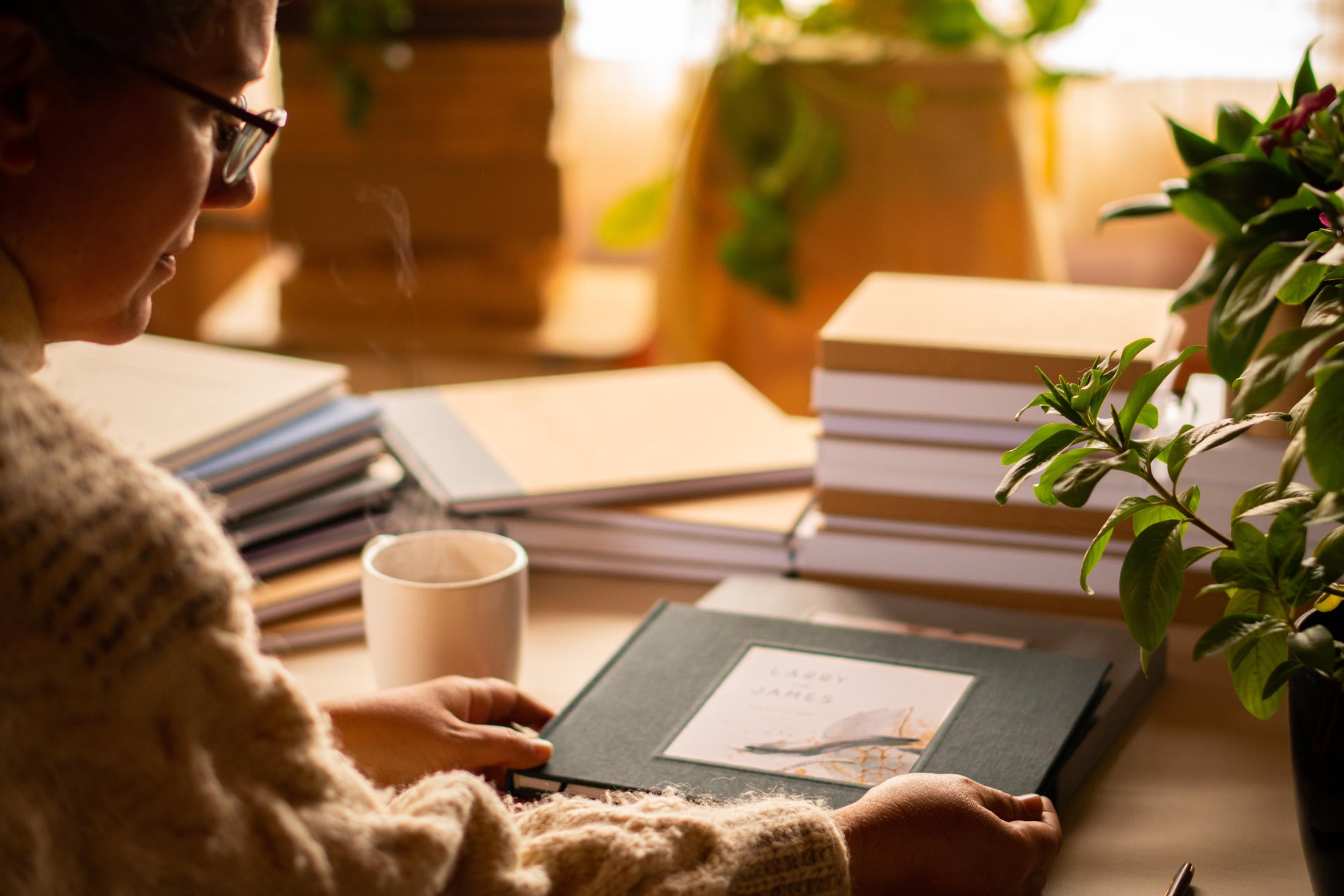 Handcrafted custom bound books laid out on a table.