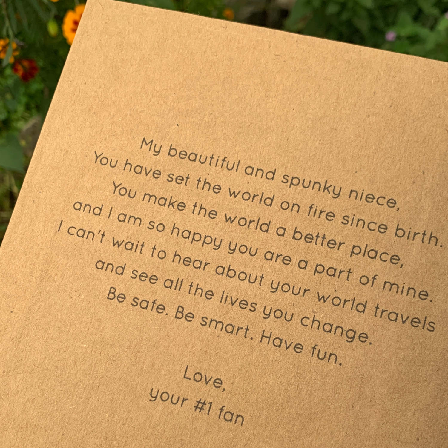 inspirational dedication message printed on the inside front cover of a custom travel journal for a woman's niece.