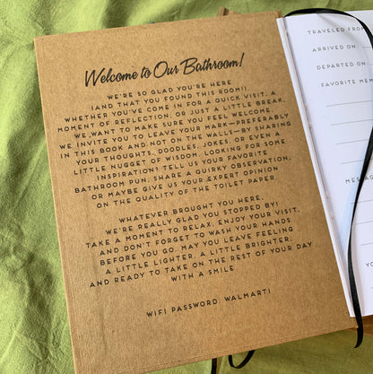 a very funny welcome message on the inside front cover of a custom guest book made for a bathroom