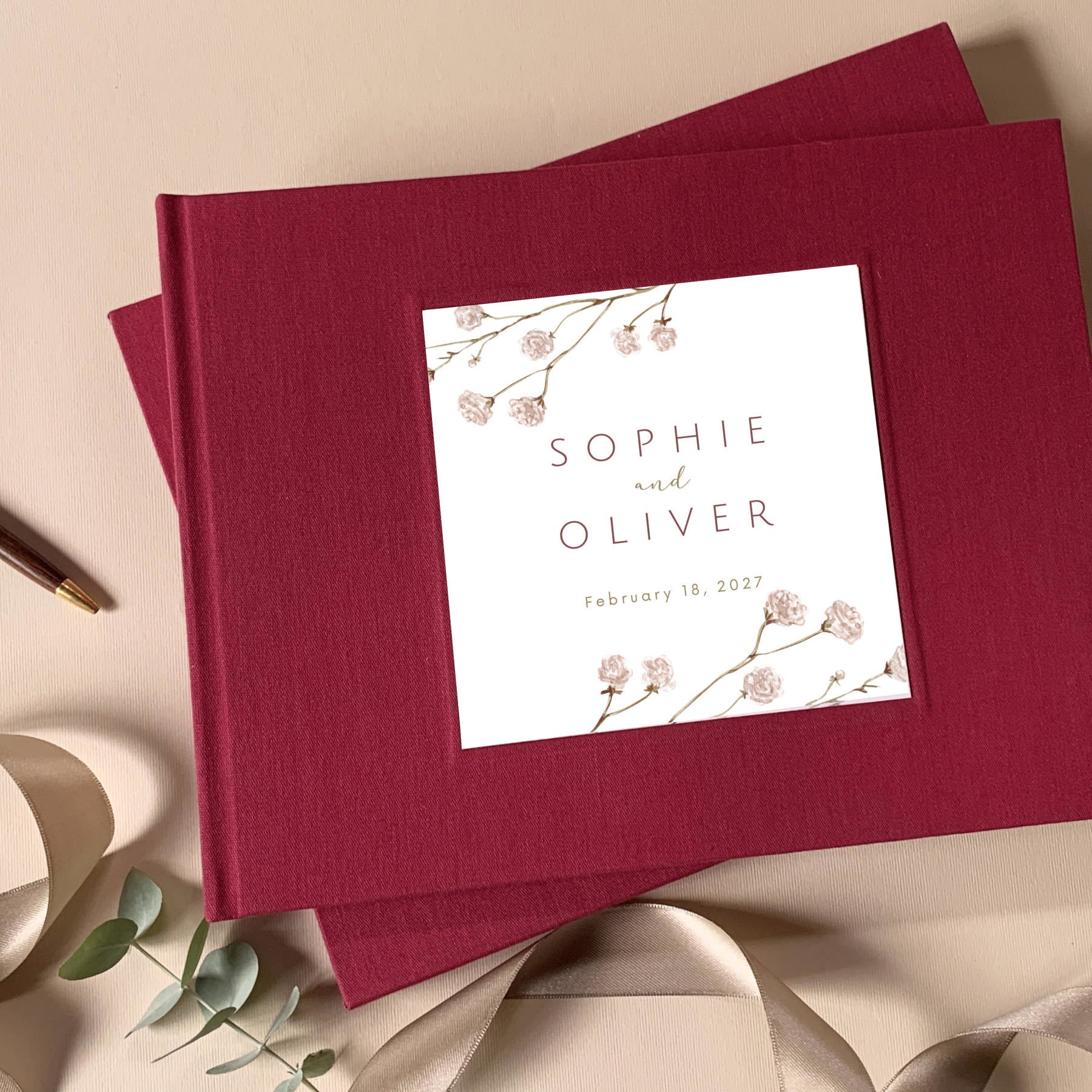 Burgundy linen custom wedding guest book with custom floral design.