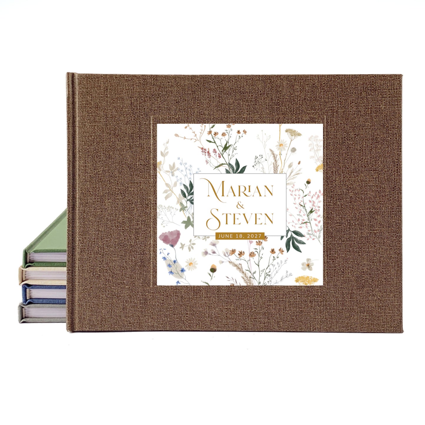 A personalized hardcover wedding guest book with a brown linen-textured cover and a floral garden illustration cover inlay reading 'Marian & Steven' and '26.01.