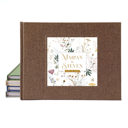 A personalized hardcover wedding guest book with a brown linen-textured cover and a floral garden illustration cover inlay reading 'Marian & Steven' and '26.01.