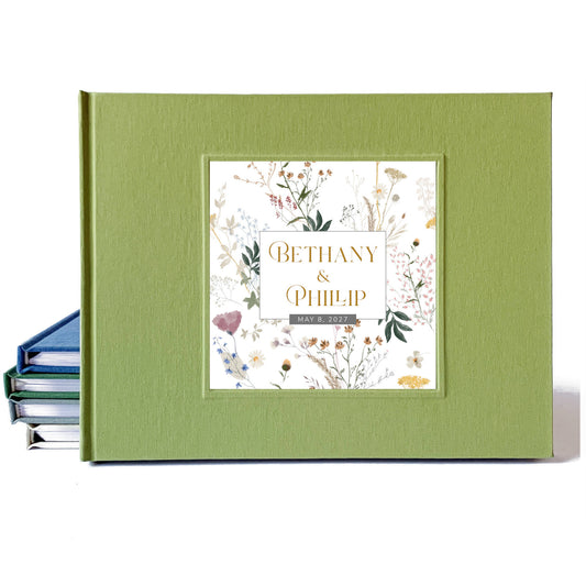 Personalized green garden wedding guest book with elegant floral design and couple’s names on the cover.