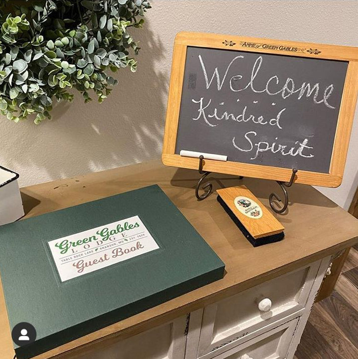 Green vacation home guest book with personalized cover, perfect for capturing memories and guest messages.