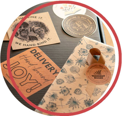 Components of a gift box for handbound books with Transient Books branding and logo.