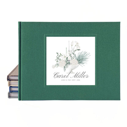 Custom green linen celebration of life guest book with white floral bouquet design and custom name and dates on the cover.
