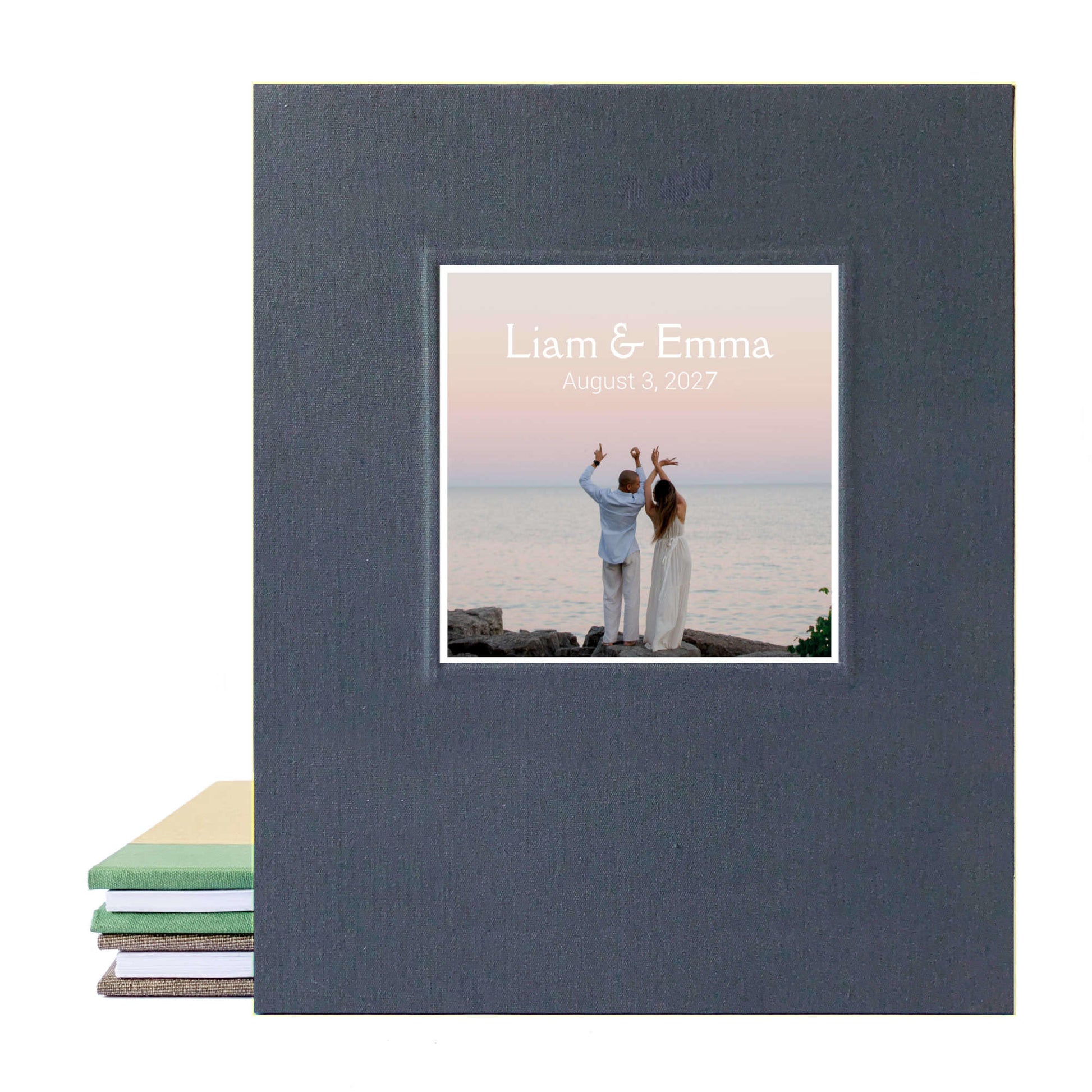 Custom made photo guest book with removable pages made for a wedding reception. Cover is full linen canvas in dark gray and the engagement photo on the cover and the couple's names. Heirloom quality.