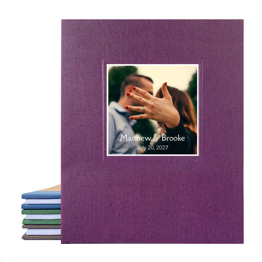 Custom made photo guest book for wedding with a full canvas purple cover and the couple's names and couple's photo on the cover. Heirloom quality.