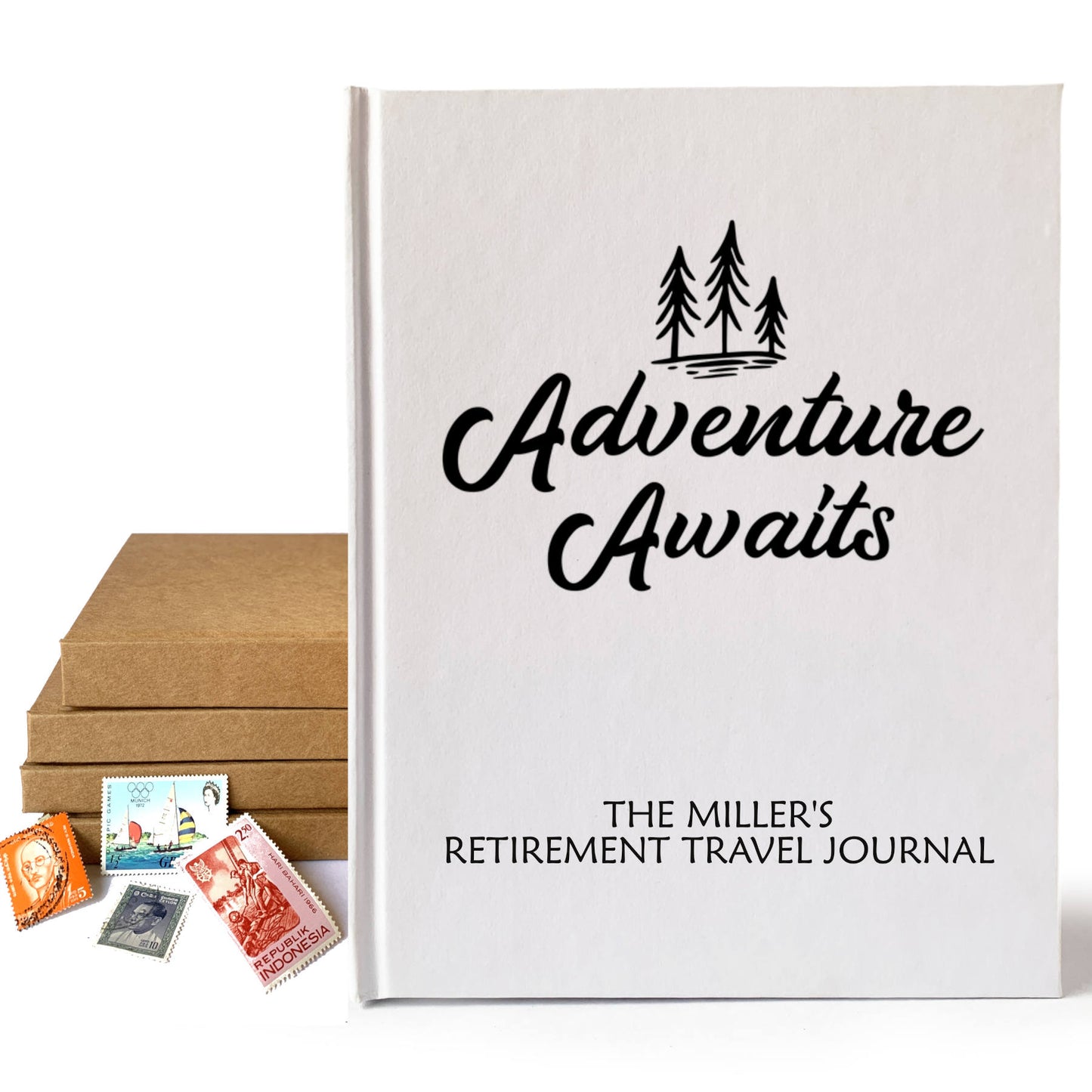 White retirement travel journal with "Adventure Awaits" cover art and personalized text. Stamps and stack of books behind, on a white background.