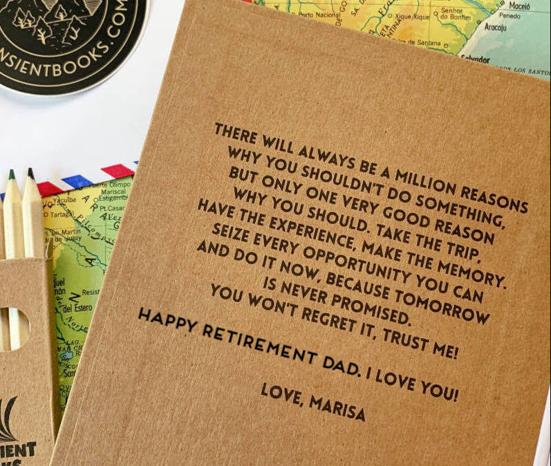 Meaningful retirement message from a daughter to her father on the inside of a custom travel journal on top of a map with colored pencils.
