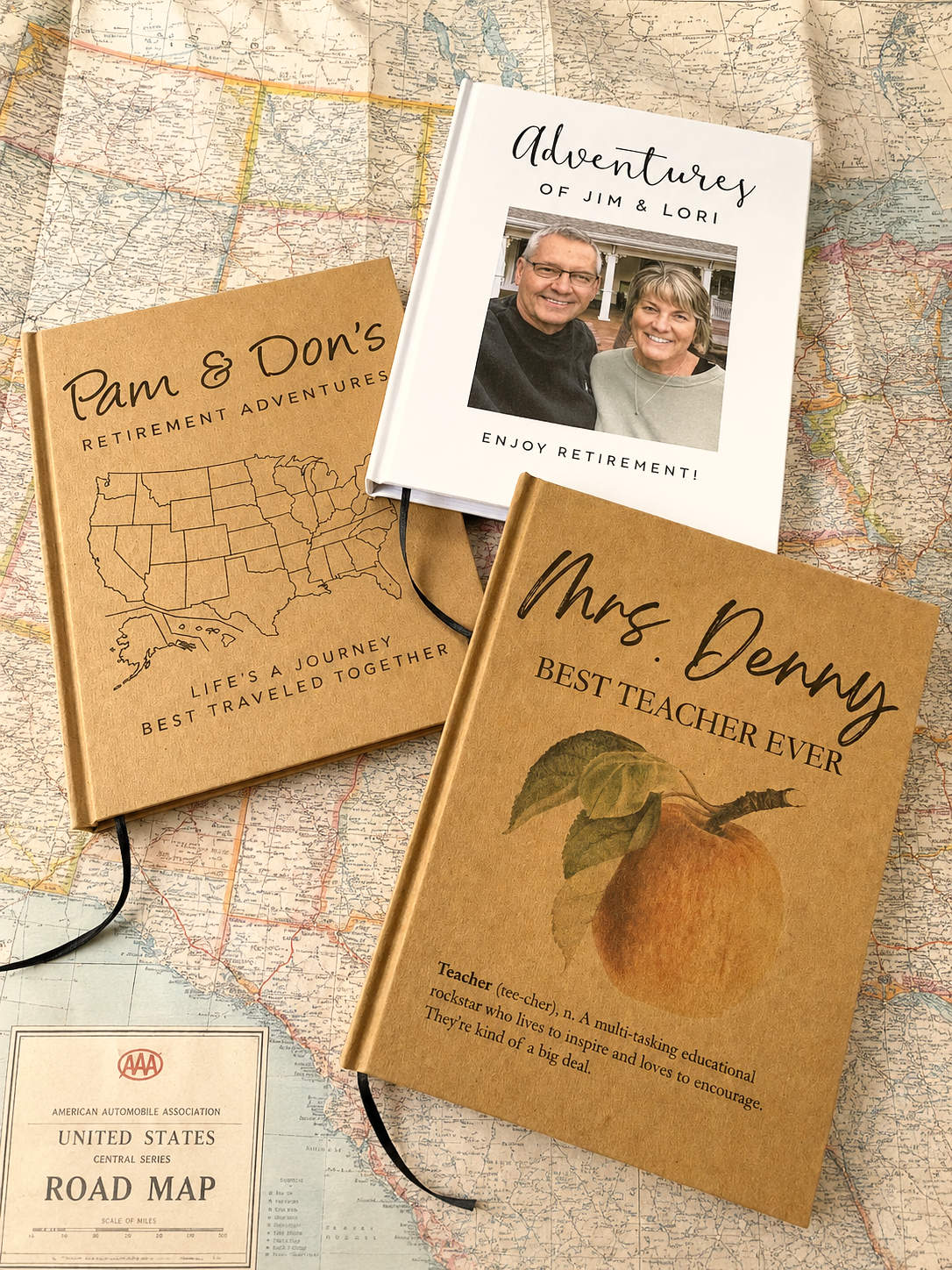 A set of 3 personalized retirement travel journals on top of a USA map. 