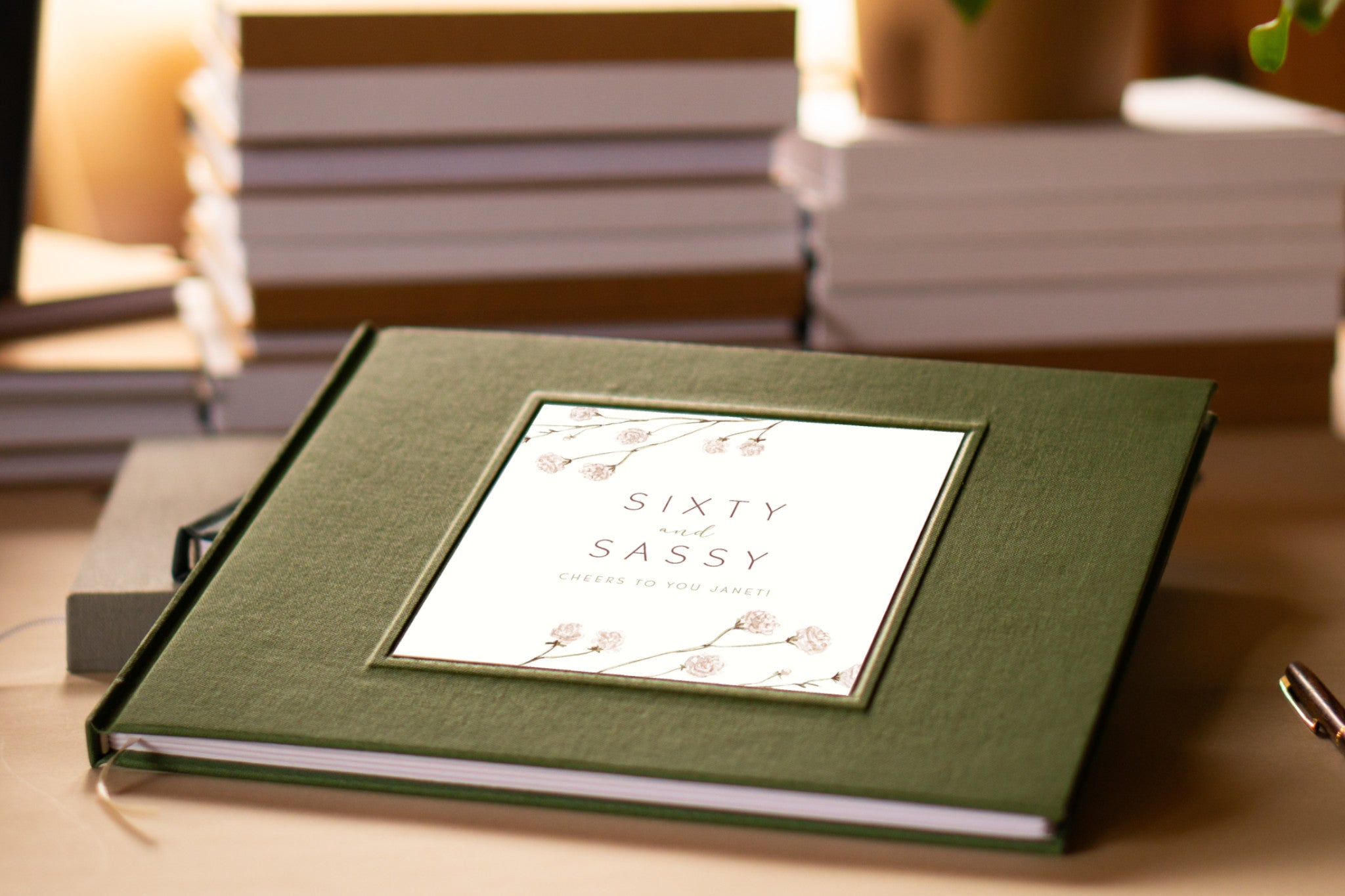 Personalized sign in book for birthday party with custom text and artwork on cover. Laying on table, ready for guests to use. Heirloom quality, handbound.
