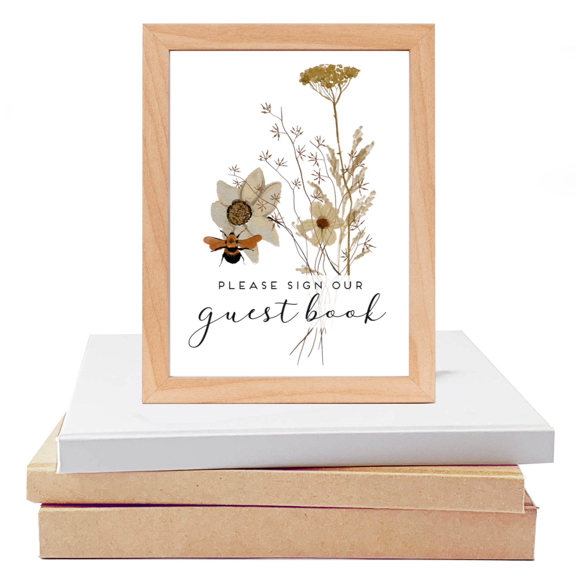 Framed print with wildflower design and text 'Please sign our guest book' on a white surface. Custom table sign for guest book available as digital file or printed.