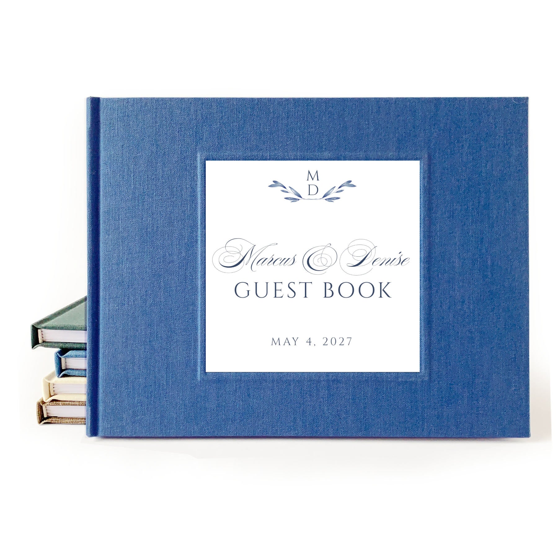Personalized navy blue linen wedding guest book with traditional script font used for the bride and groom's names.