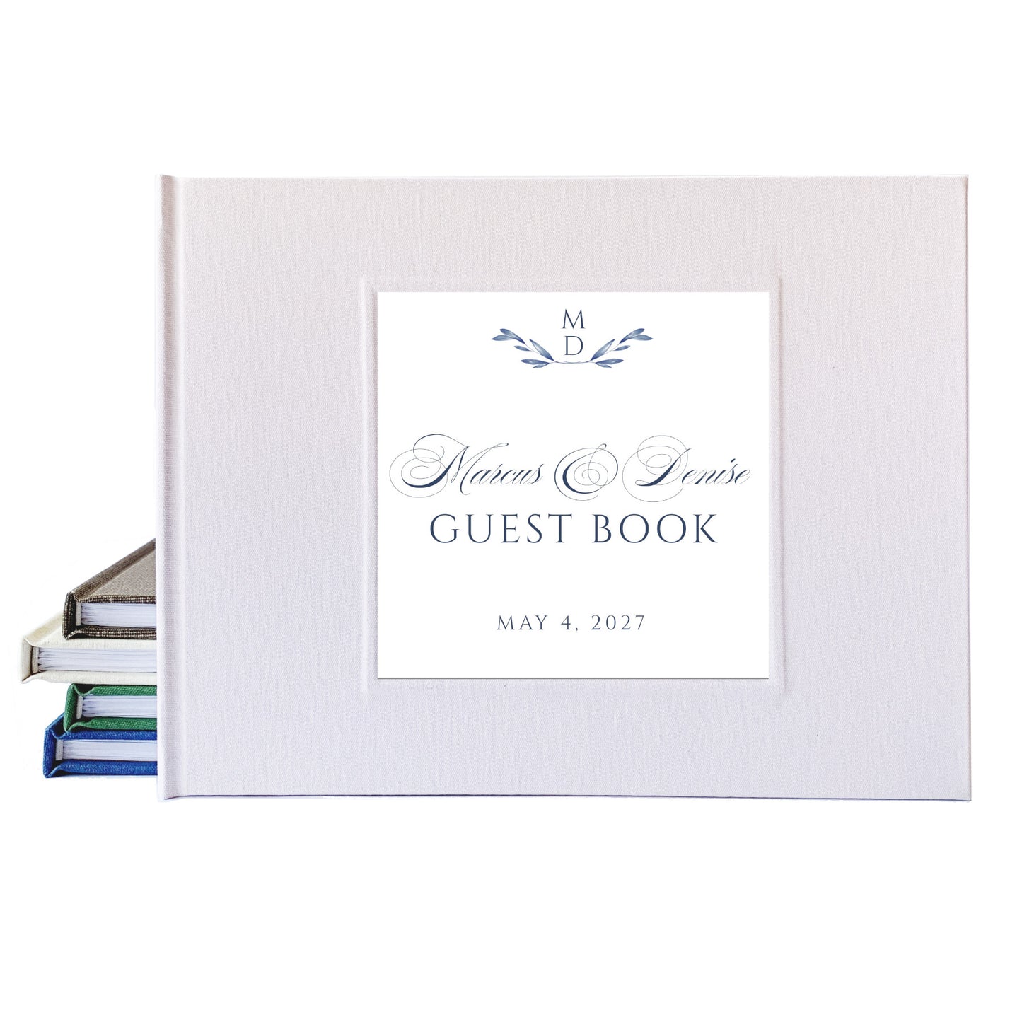 Personalized white linen wedding guest book with traditional script font used for the bride and groom's names.