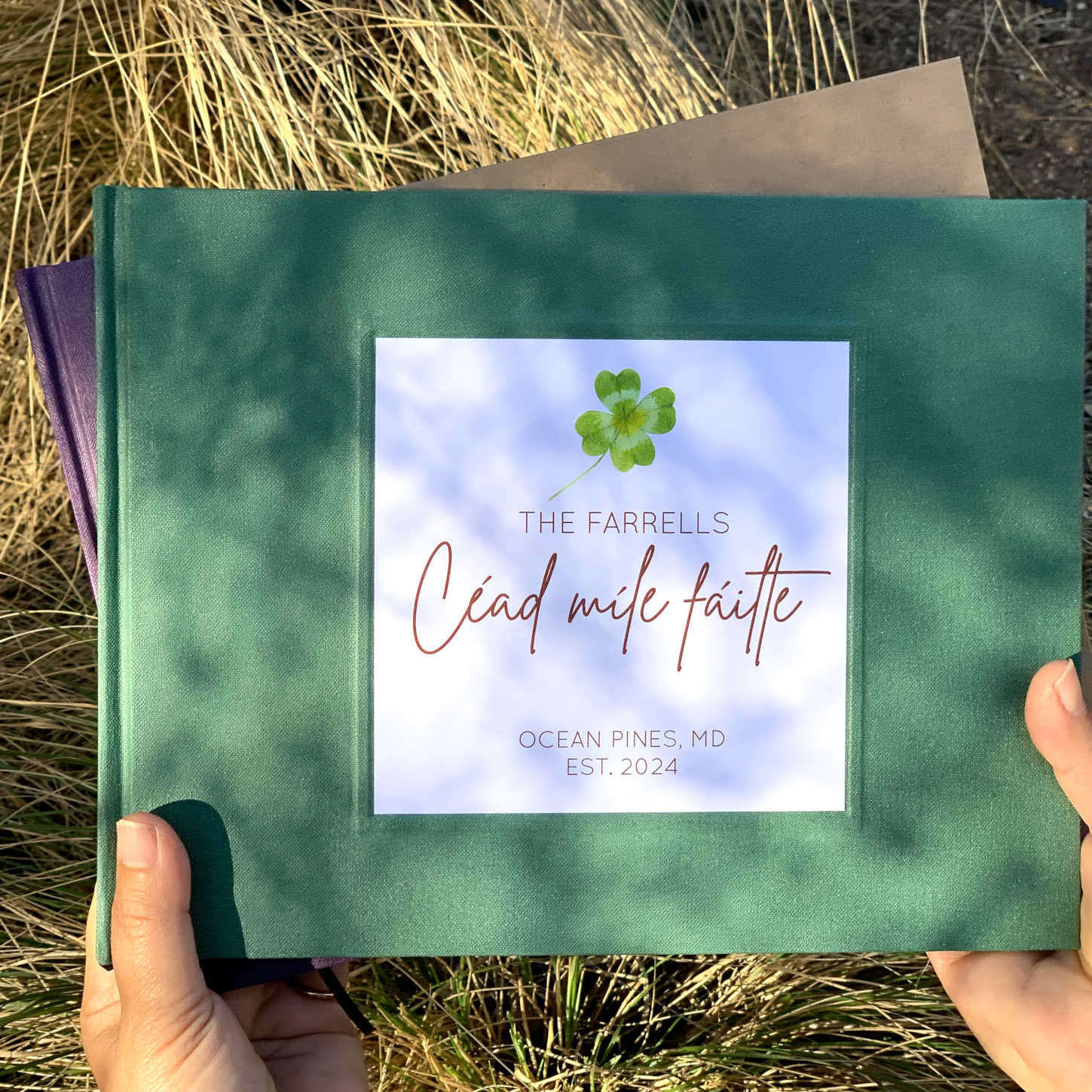 Forest green vacation rental guest book with clover leaf icon on cover,  personalized text. Hard back. Hand held. Very high quality and modern.
