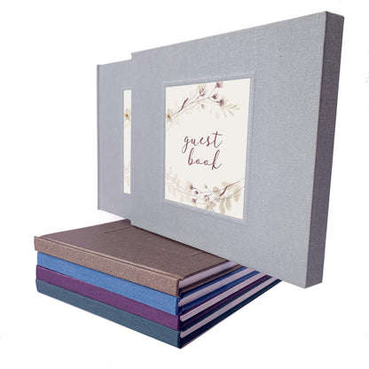 Gray wedding guest book with plum floral design, personalized and shown in matching book slipcase.