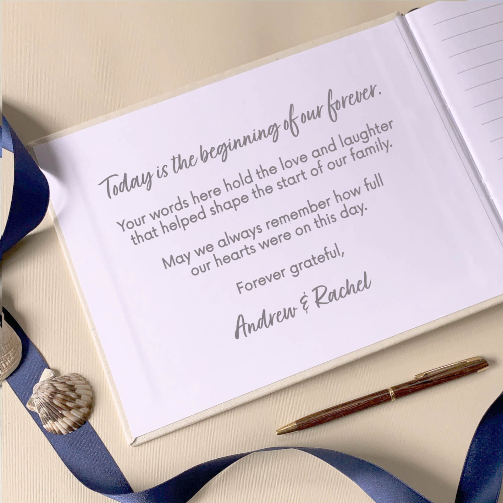 Personalized welcome message custom printed on the inside of a wedding guest book on a decorative wedding guest book table with a pen.