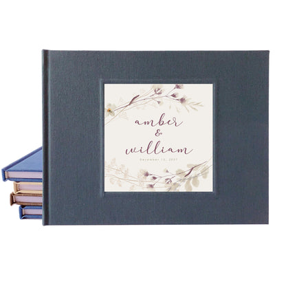 Dark gray linen wedding guest book with personalized rustic plum design o the cover.