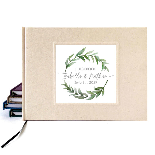 Cream linen bridal guest book with personalized watercolor wreath on the cover. Hardback, handcrafted.